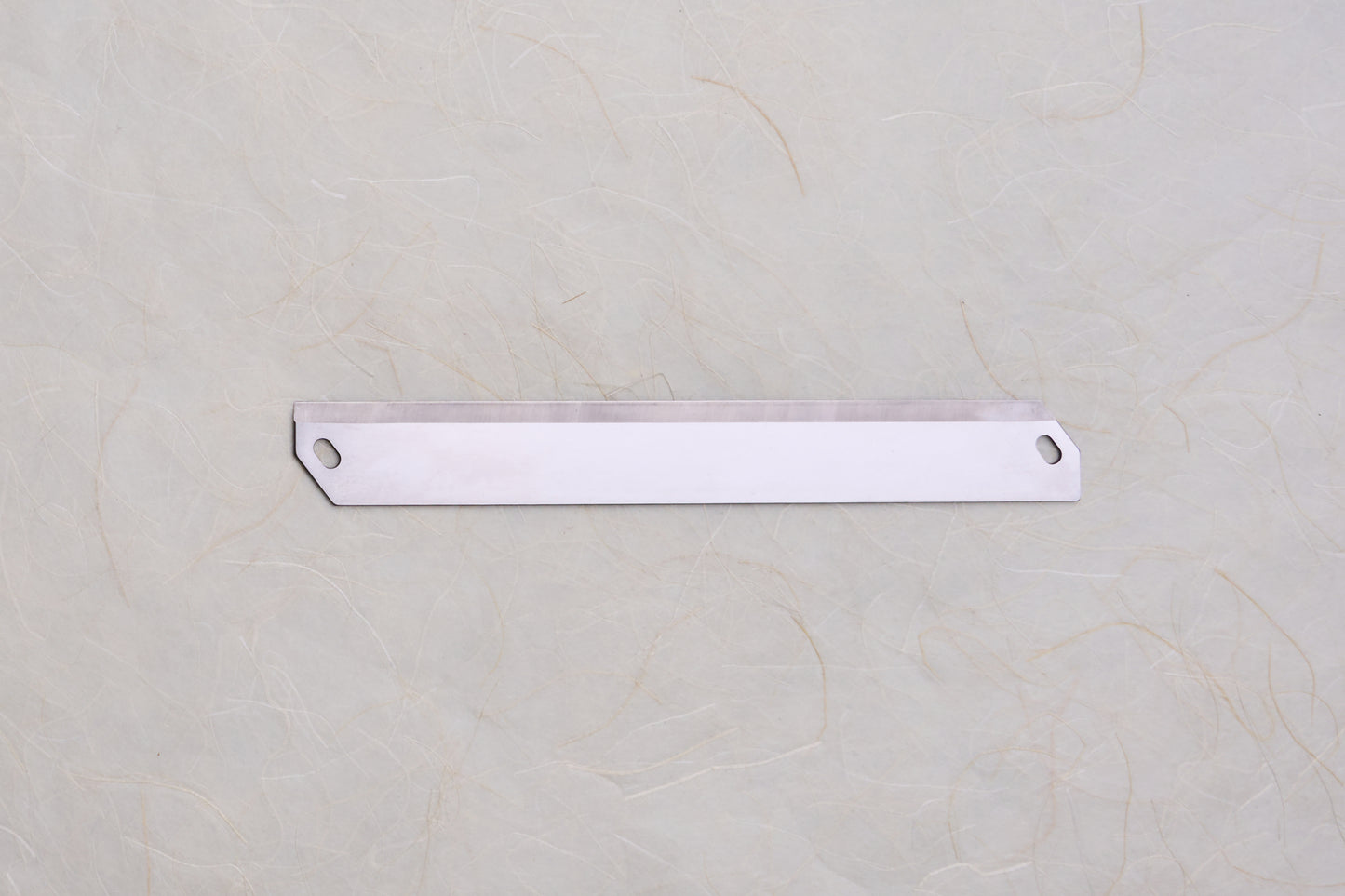 Replacement Blades for Chiba Mandoline Slicers, featuring a long, thin steel blade with straight cutting edges and mounting holes, ideal for woodworking planers or paint scrapers.