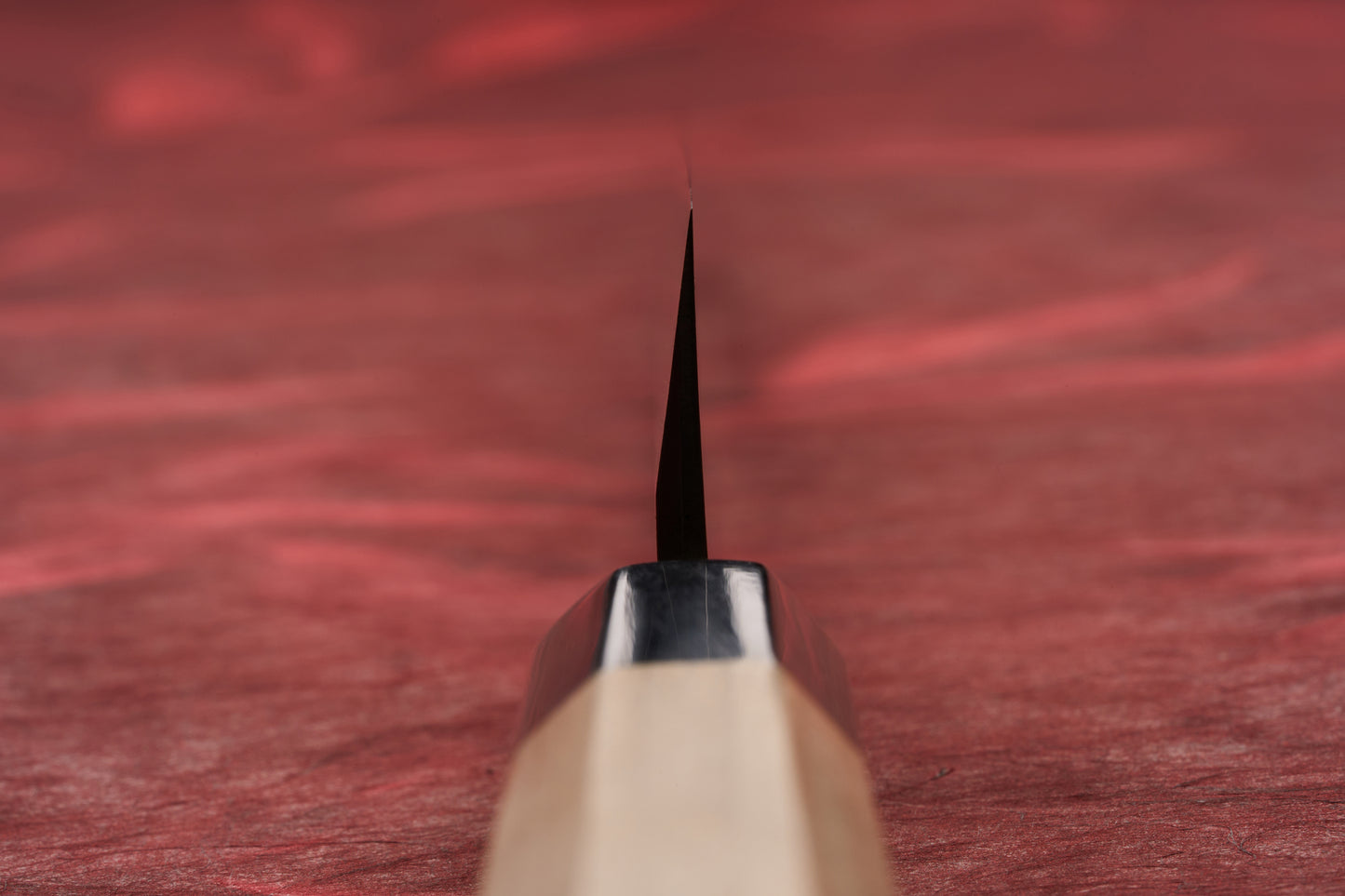 Touroku Sakai Tohwa Shirogami Yanagiba 240mm, seen edge-on, highlights its sleek, single-bevel blade and octagonal handle, epitomizing precision for slicing sashimi, as showcased by Knifewear's curated Japanese steel selection.