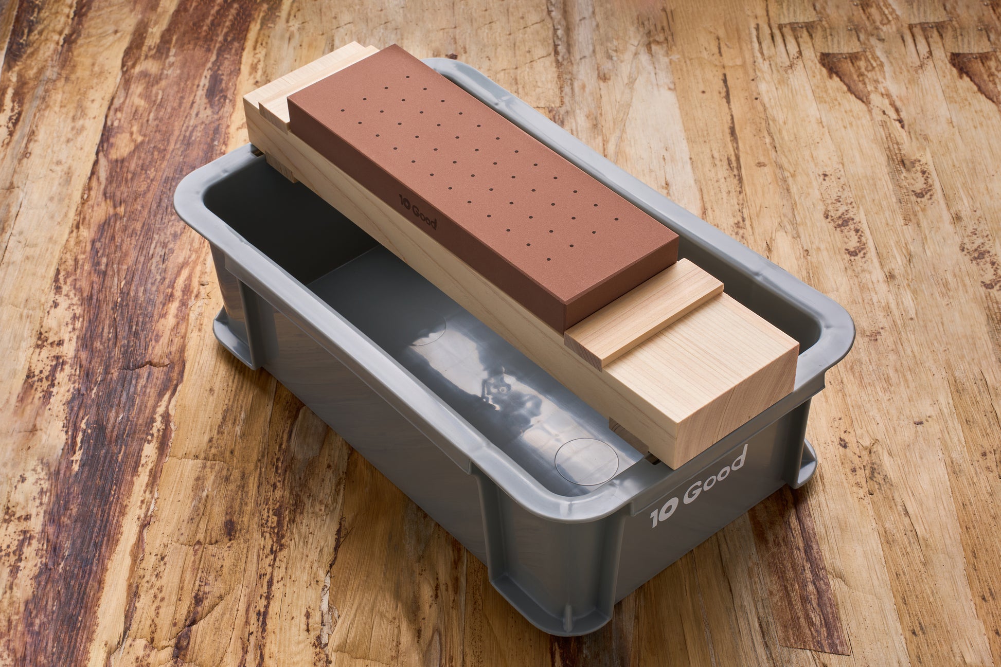 10 Good Togiba 5 Piece Set with waterstone, wooden base, and soaking tub for precise knife sharpening on display.