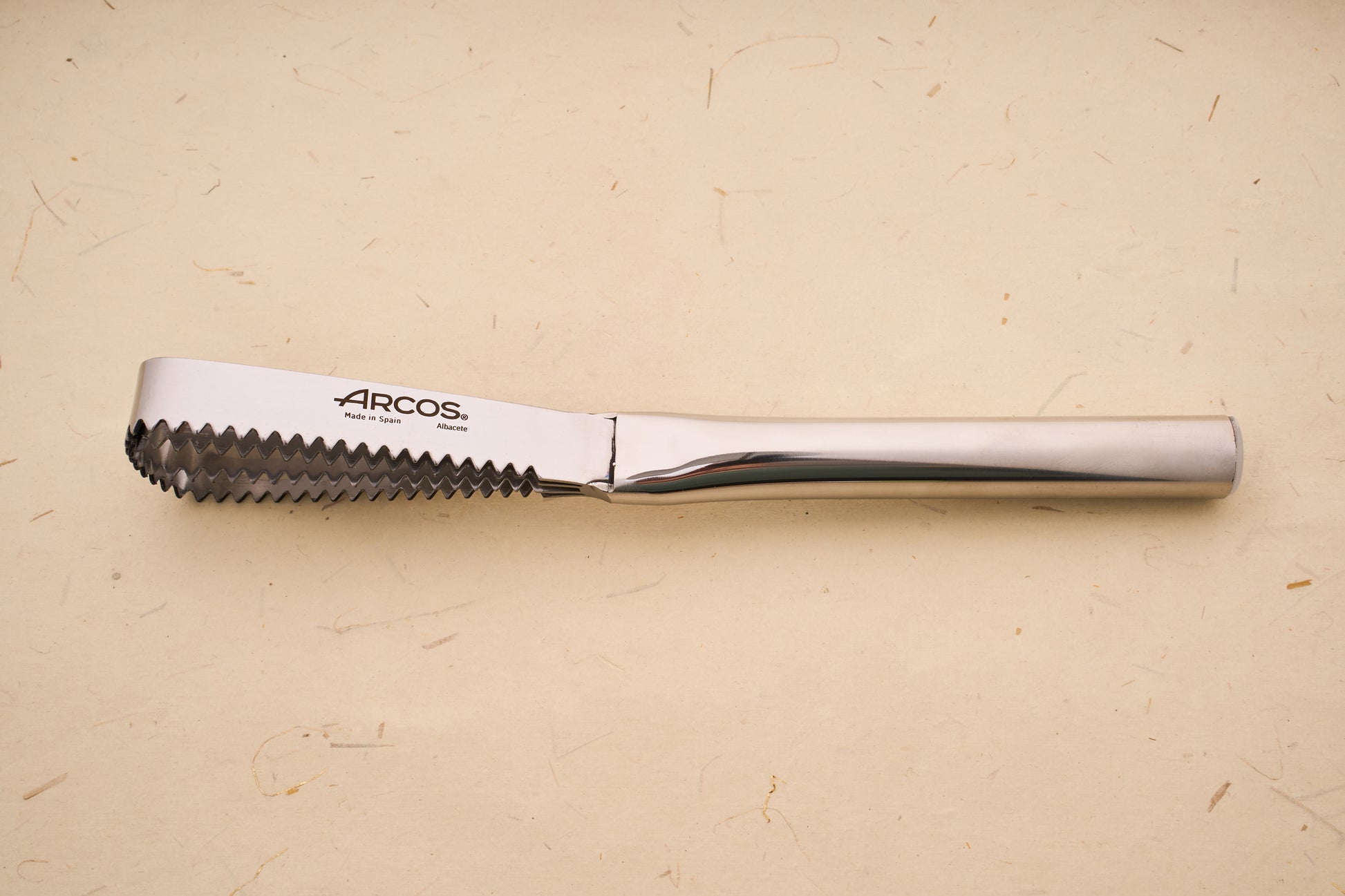 Arcos Scaling Knife with large serrations and stainless steel blade, marked Made in Spain and Albacete, showcasing traditional craftsmanship from Arcos Hermanos.