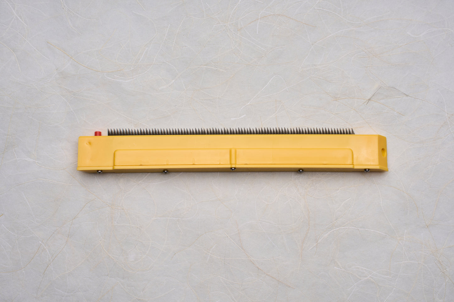 Replacement Blades for Chiba Mandoline Slicers, featuring a yellow plastic housing and metal teeth, suitable for precise slicing tasks in culinary applications.