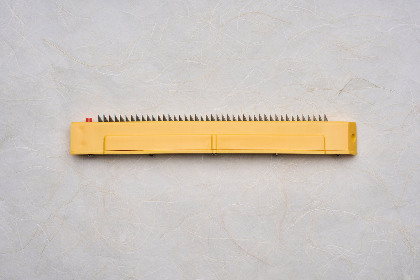 Replacement Blades for Chiba Mandoline Slicers featuring a yellow handle and sharp triangular metal teeth, ideal for precise slicing tasks.