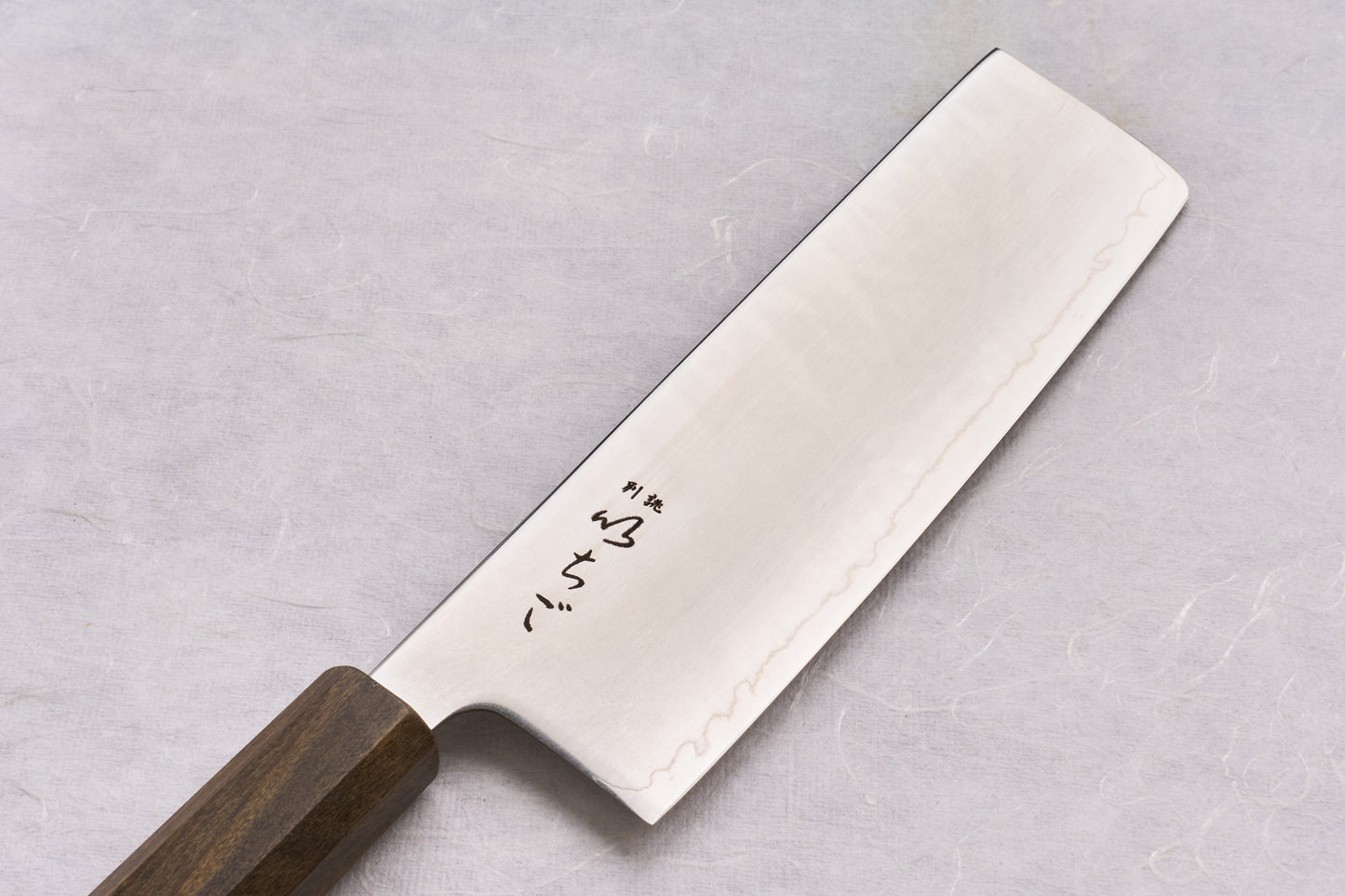 ICHIGO SLD Migaki Nakiri 160mm features a polished stainless blade with Japanese engravings and an octagonal dark wood handle, ideal for precise vegetable chopping.