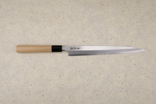 Masamoto KK Shirogami Kasumi Yanagiba 240mm knife with a polished single-bevel steel blade and etched Japanese characters, featuring an octagonal wooden handle, perfect for precise sashimi slicing.