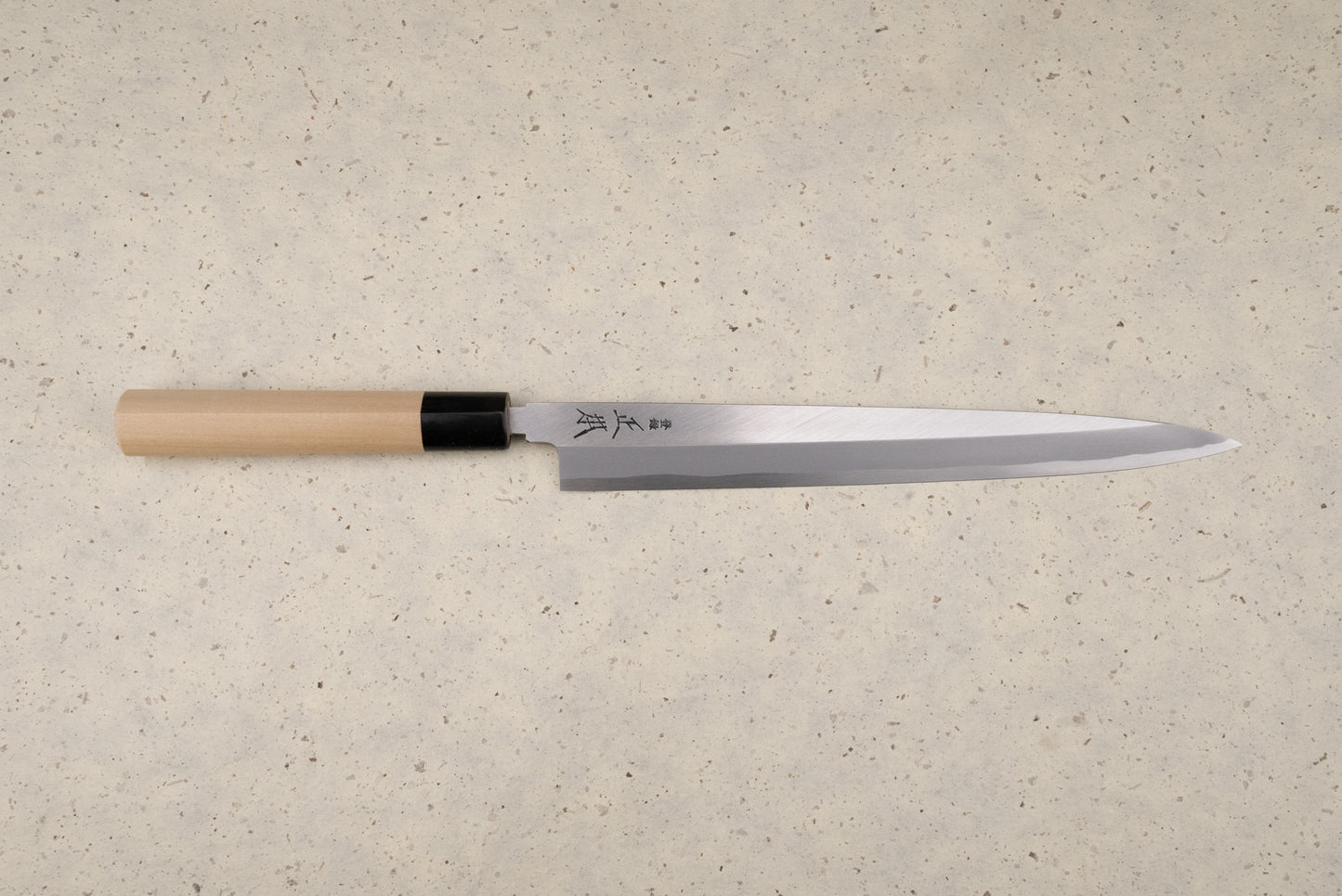 Masamoto KK Shirogami Kasumi Yanagiba 270mm, a traditional Japanese sashimi knife, features a long single-bevel steel blade with kanji and a straight wooden handle, ideal for precise fish slicing.