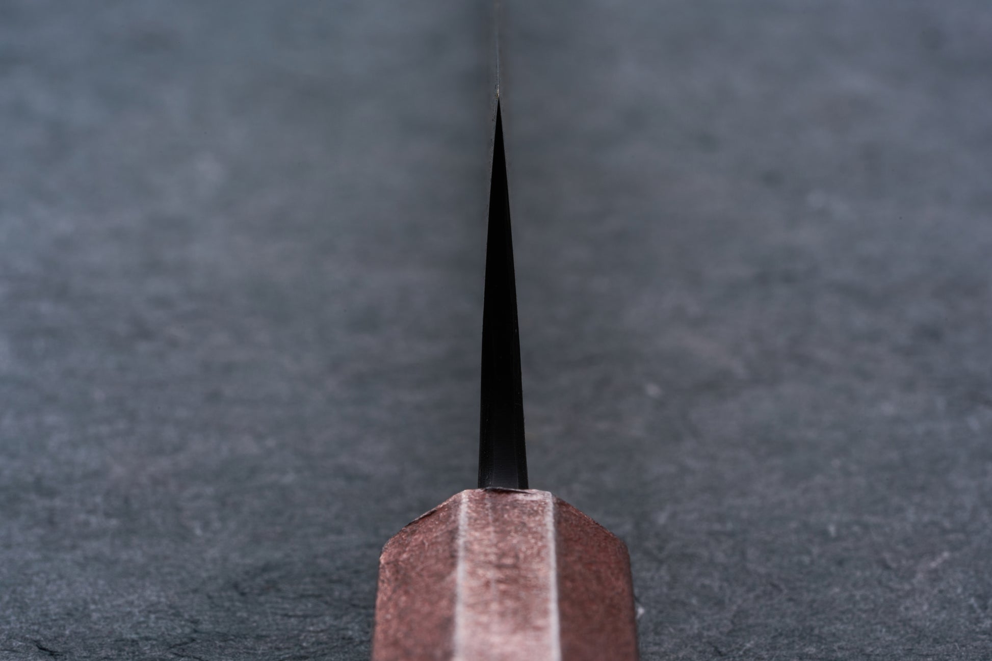 Mazaki Aoichi Beads Black Damascus Sujihiki 300mm knife, featuring a bronze bolster and thin black blade, ideal for precise slicing of meats and proteins.