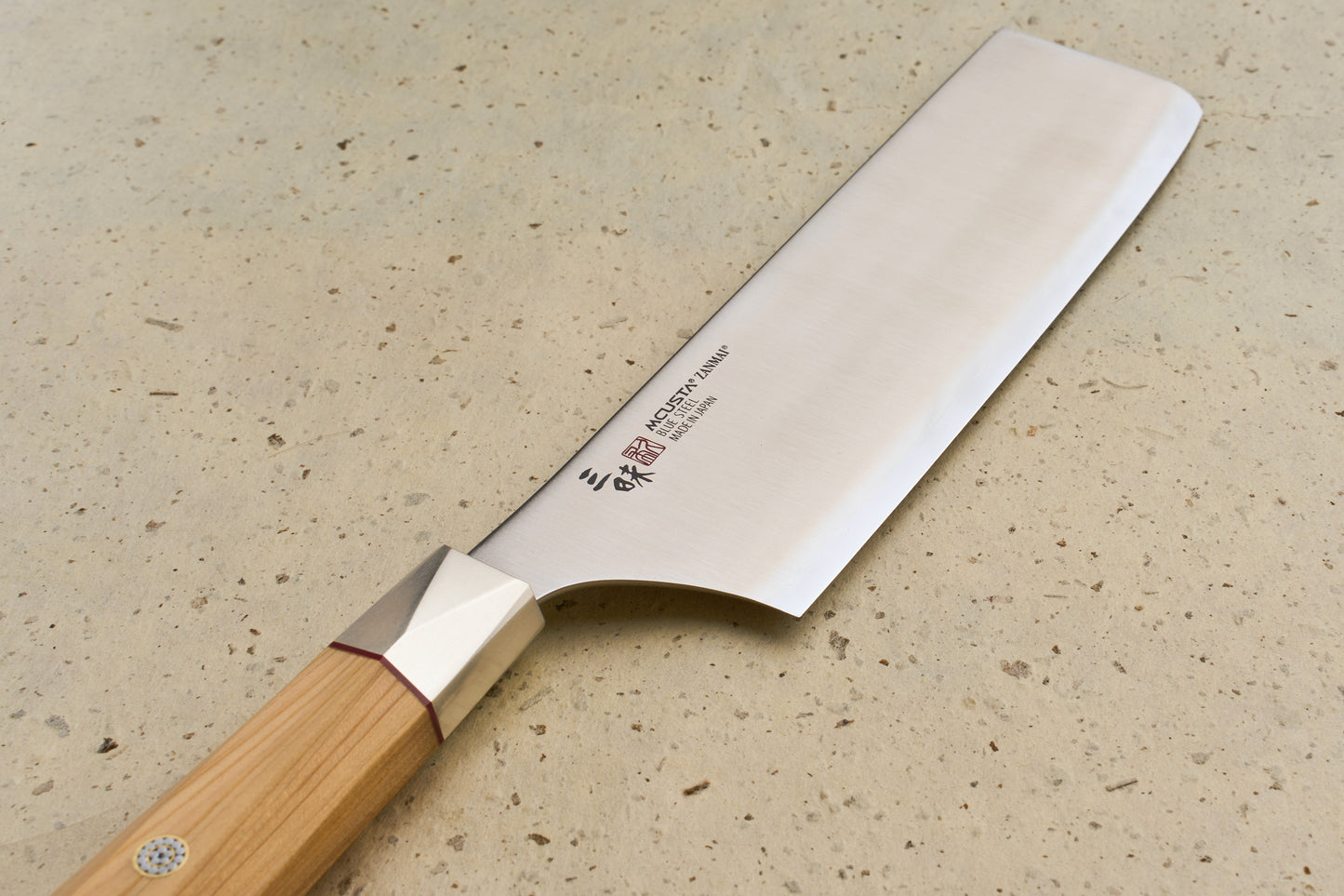 Mcusta Zanmai Beyond Nakiri 165mm features a polished steel blade and Hinoki wood handle, ideal for precise vegetable chopping. Crafted in Seki City, it embodies Japanese craftsmanship and luxury.