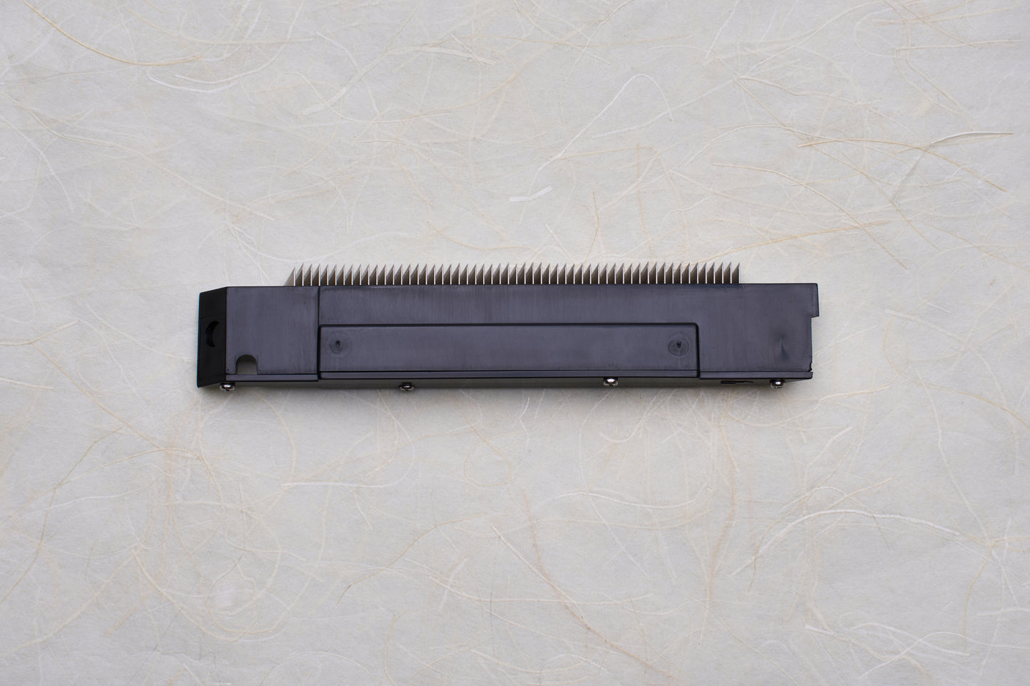 Replacement Blades for Chiba Mandoline Slicers, featuring a black module with aligned metal prongs, designed for seamless integration into precision kitchen slicing tools.