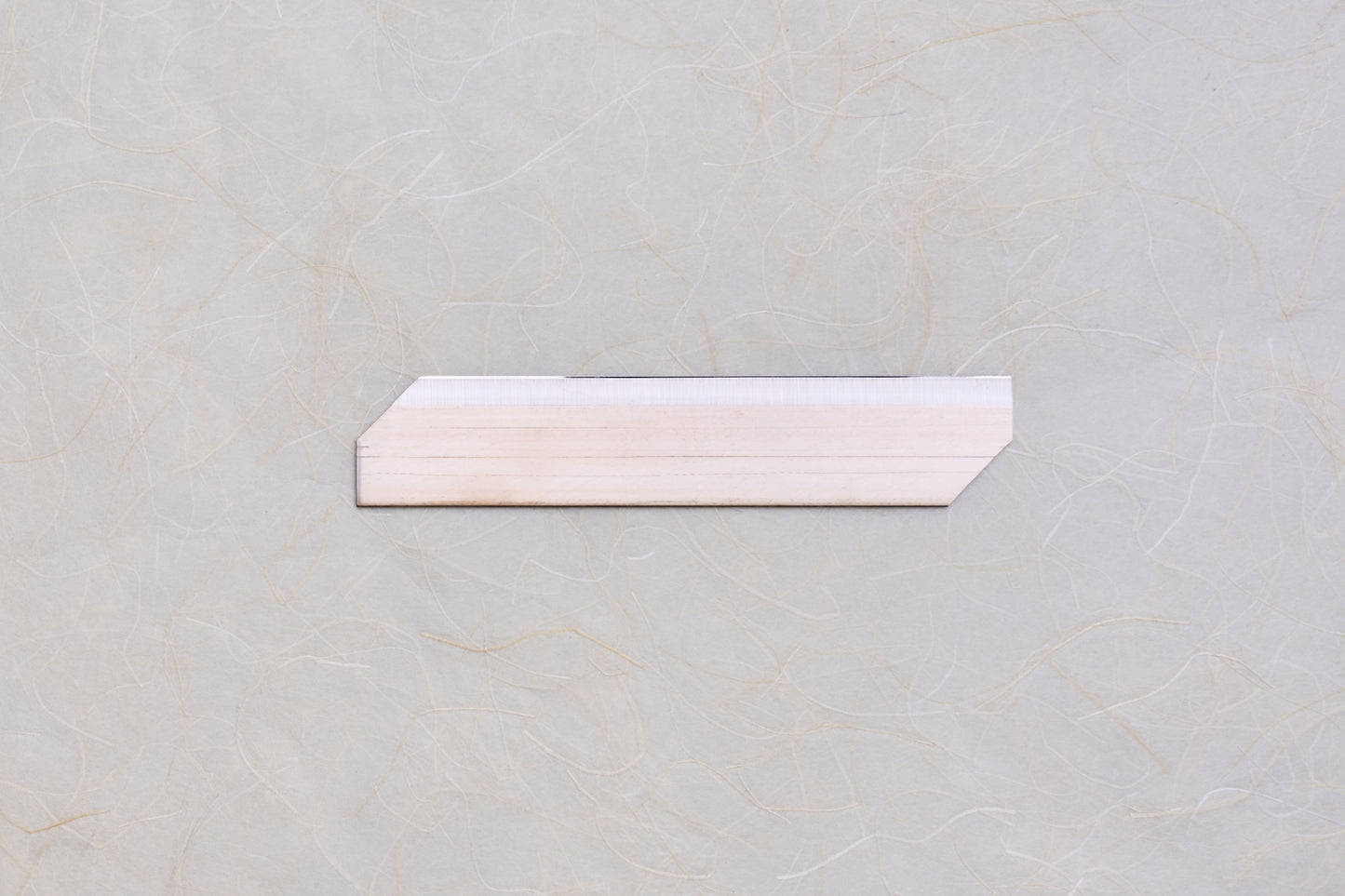 Replacement Blades for Chiba Mandoline Slicers, featuring a trapezoidal wooden shim with chamfered ends, ideal for precise slicing adjustments in Japanese kitchen tools.