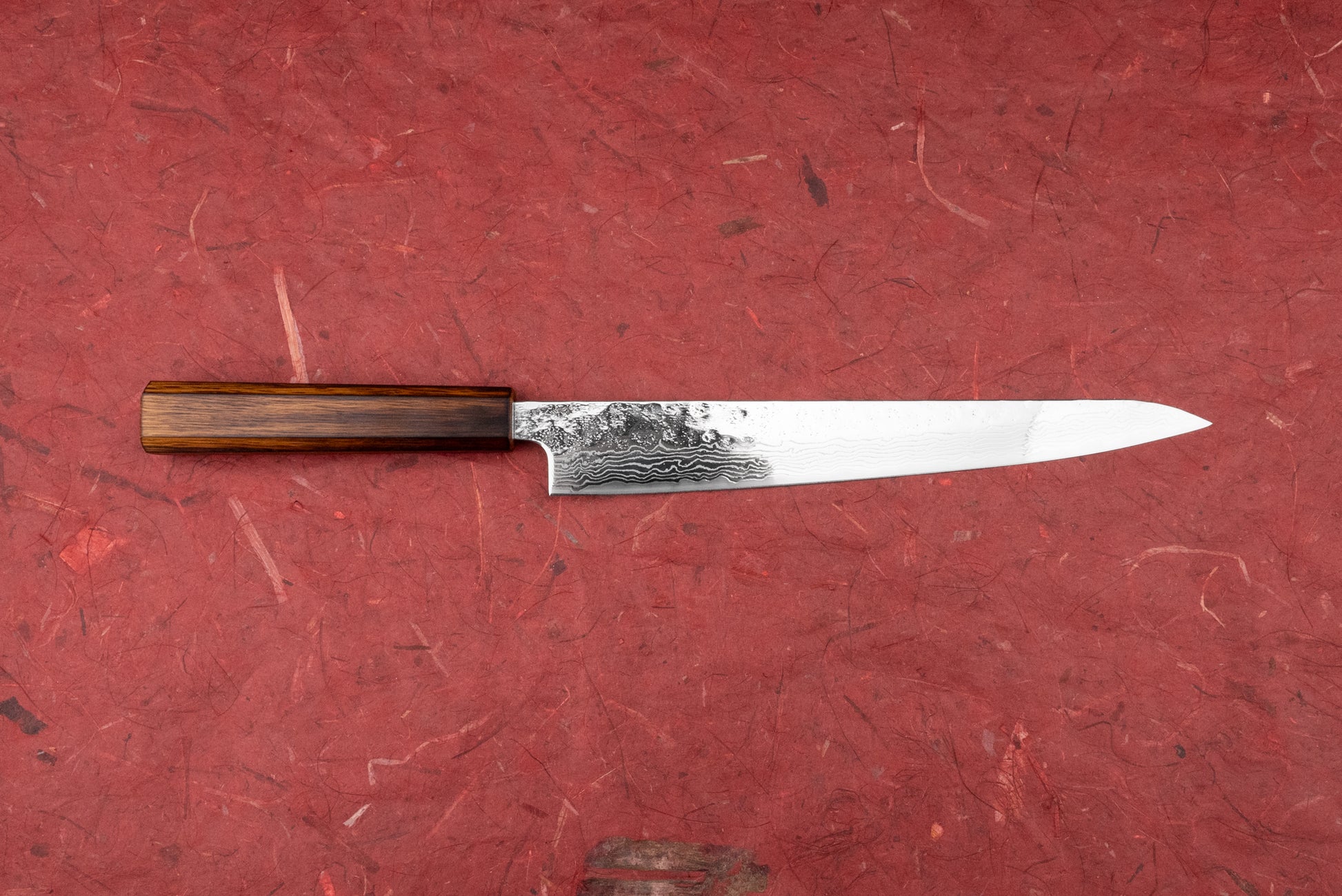 Tsunehisa 440C Sanjusan 参拾参 Tsuchime Migaki Damascus Sujihiki 240mm T-03312: A slender Japanese yanagiba knife with a hammer-textured Damascus blade and octagonal wooden handle, ideal for precise meat slicing.