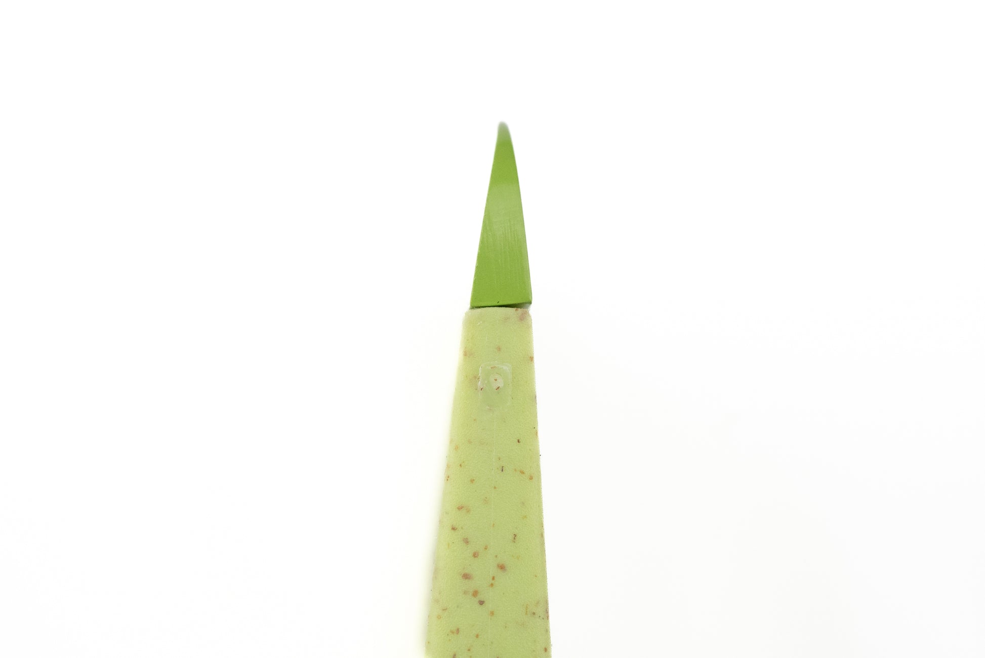 Close-up of the Skagfa Kid's Knife, resembling a succulent leaf tip with a dull blade, designed for safe fruit and vegetable cutting, encouraging children to participate in kitchen activities.