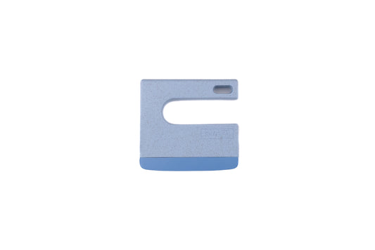 Skagfa Kid's Knife: A hand-held scraper tool with a rigid speckled plastic body and flexible blade, designed for safe kitchen use, ideal for introducing children to cooking.
