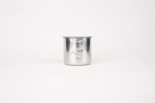 Stainless Steel Measuring Cup for Rice 180ml, featuring embossed volume markings, ideal for precise rice measurement. This traditional Japanese kitchen tool complements Knifewear's curated selection of handcrafted chef essentials.