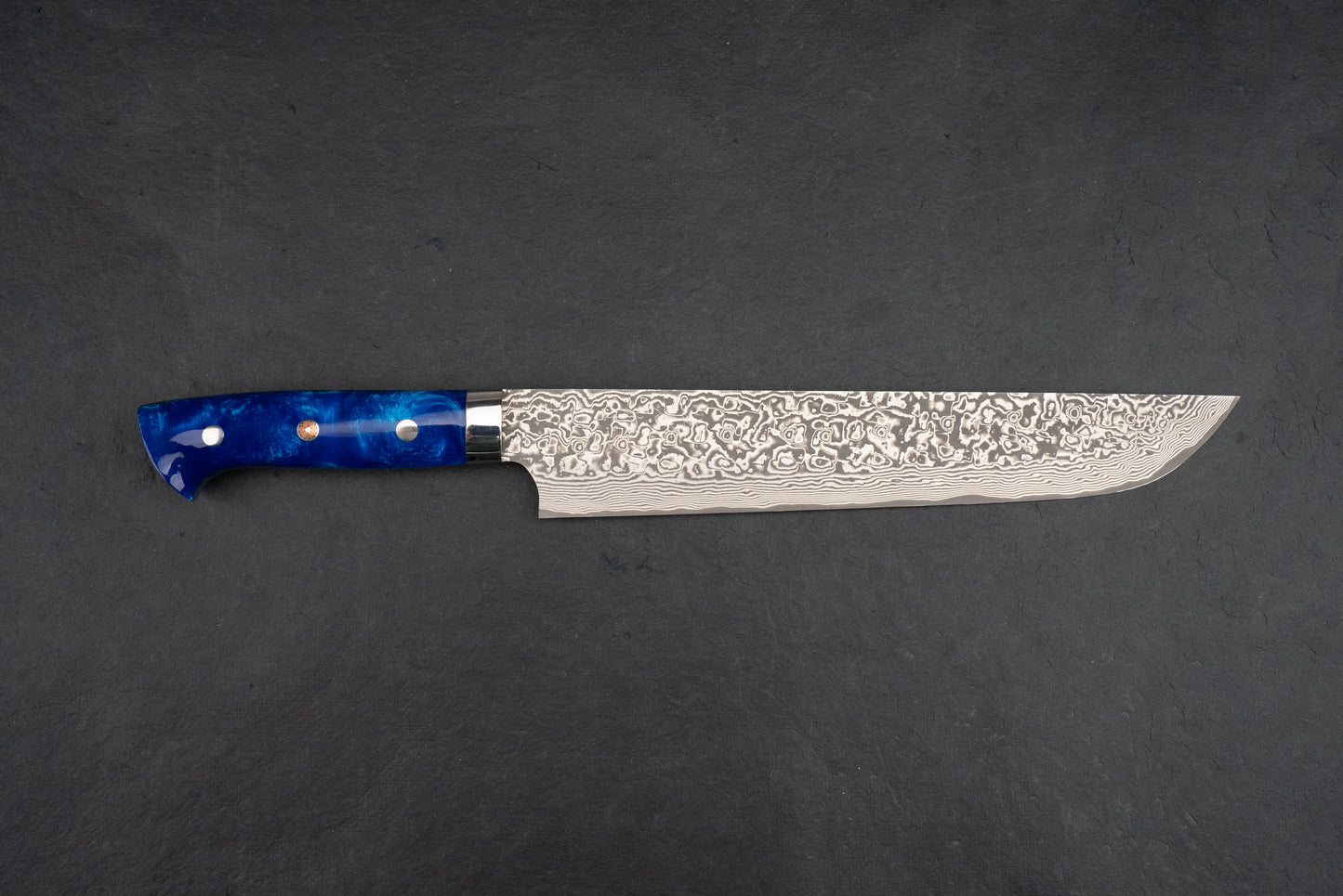 Takeshi Saji SG2 Black Damascus Western Sakimaru Sujihiki 240mm knife features a long steel blade with Damascus pattern and a deep blue handle, ideal for precise slicing of meats and proteins.