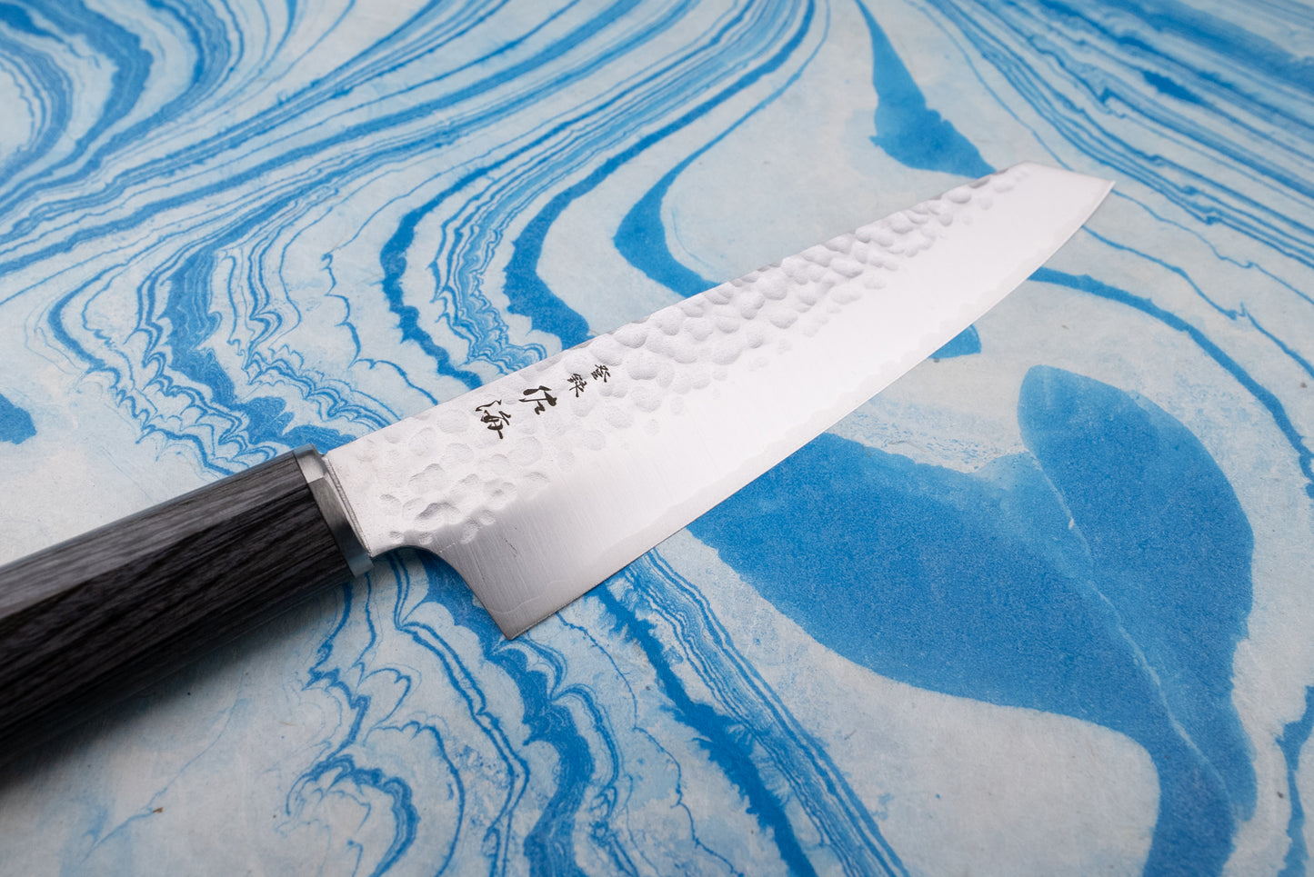 Touroku Sakai Gekka Ko-Bunka 150mm knife features a hammered blade and dark wooden octagonal handle, showcasing exquisite Japanese craftsmanship, ideal for precise kitchen tasks.