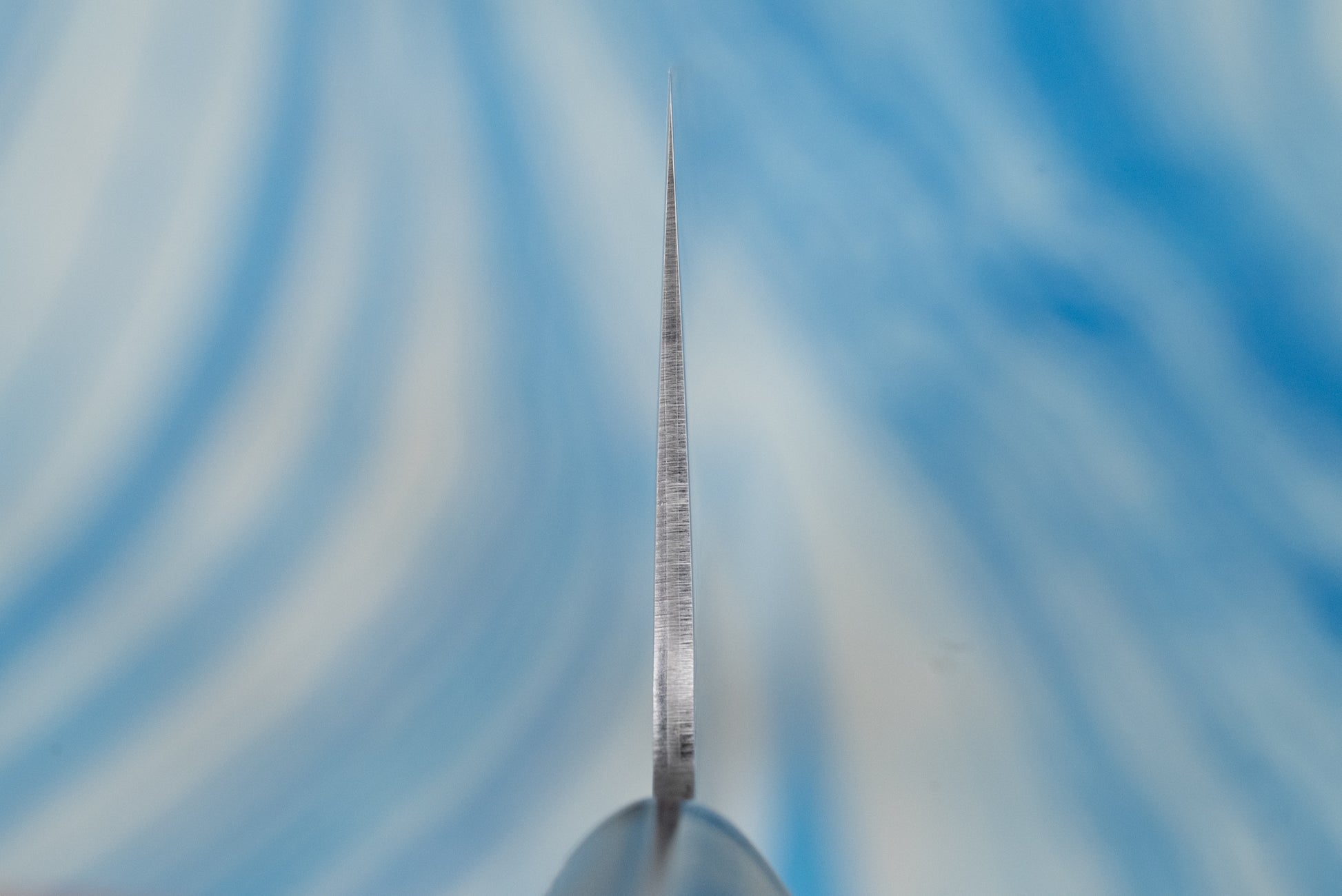 Touroku Sakai Gekka Nakiri 180mm close-up, showcasing a precision-crafted blade tapering to a fine point, highlighting its exceptional sharpness and craftsmanship, ideal for precise vegetable chopping.