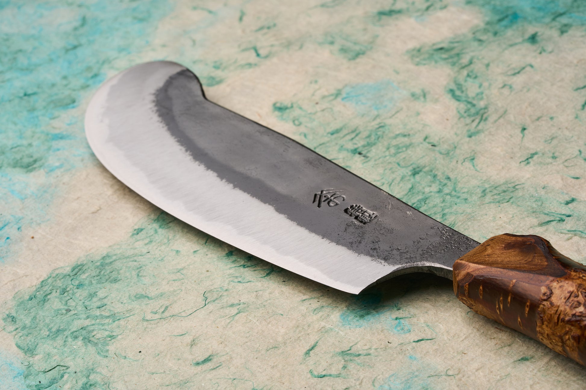 Tottori Otsuka Hamono Aoichi Table Knife 155mm features a polished edge, distinctive hamon, and stamped maker’s marks, with a contoured burl-wood handle, showcasing masterful Japanese craftsmanship.