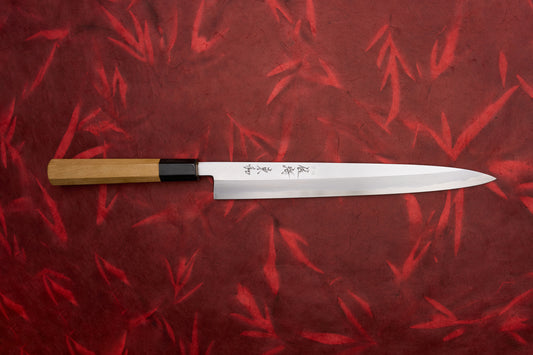 Touroku Sakai Tohwa Shirogami Yanagiba 270mm knife features a slender, single-bevel stainless-steel blade with Japanese engravings, black ferrule, and octagonal wooden handle, perfect for slicing sashimi and carving meats.