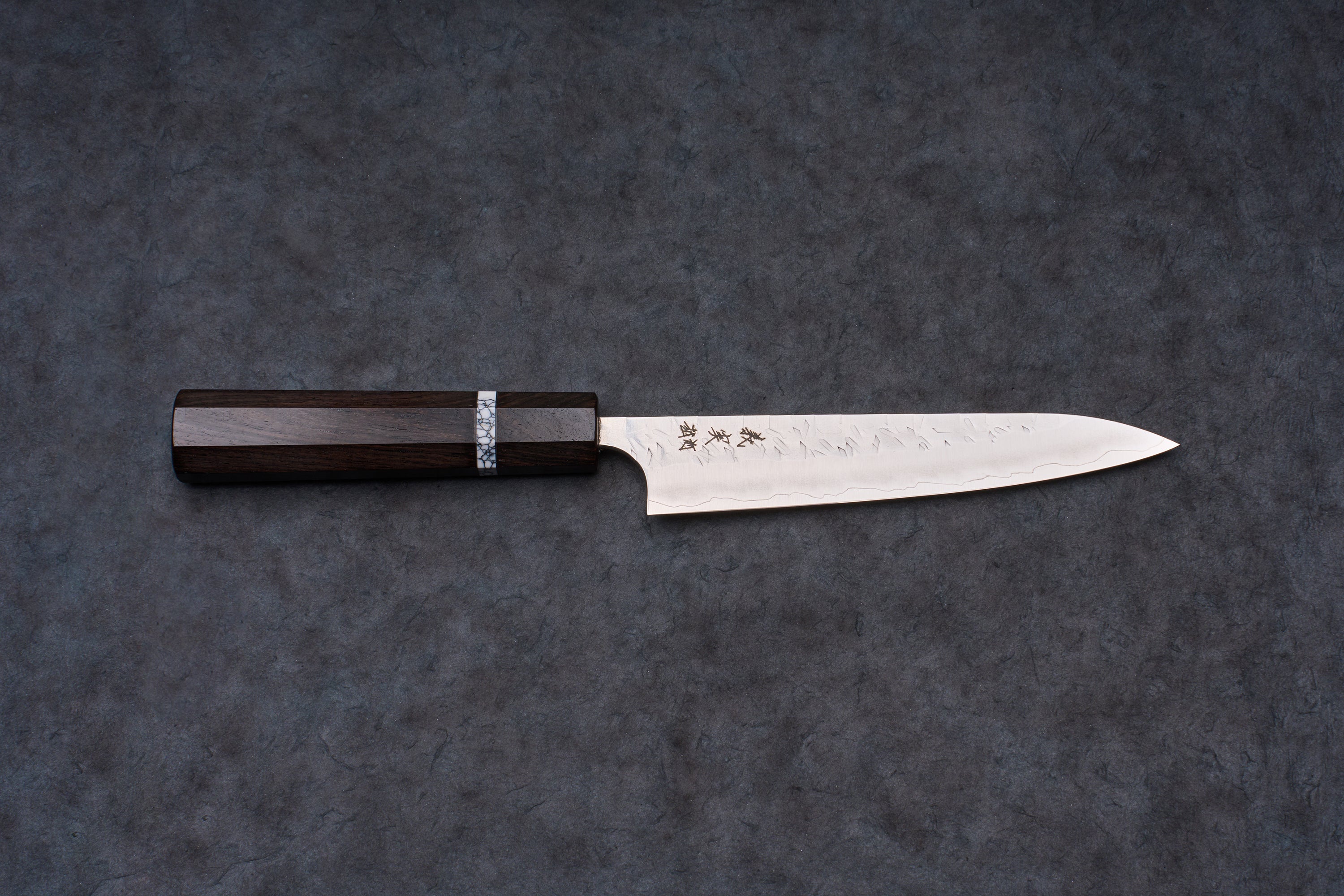 Yoshimi Kato SG2 Hyo Petty 150mm knife, featuring a slender steel blade with a hammered texture, etched Japanese characters, and an octagonal dark wood handle.