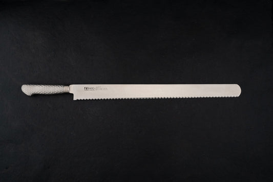 Brieto Pro Bread Knife 450mm M1146 with a hammered metal handle and extra-long serrated blade, ideal for precise slicing, showcased against a dark backdrop, embodying Knifewear's dedication to unique Japanese craftsmanship.